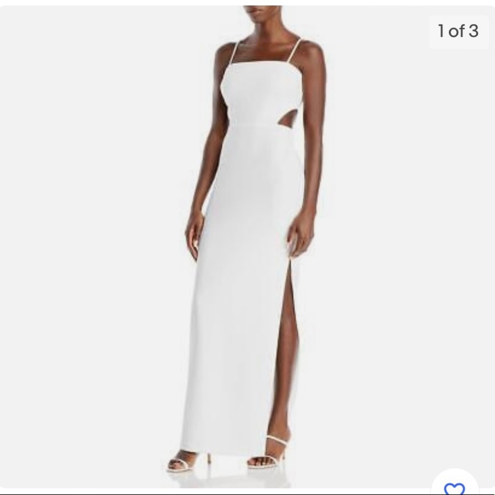 New with tags never worn Aqua white gown with cut outs. Size 6.